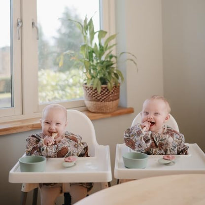 mushie Long Sleeve Baby Bib | Water Resistant Adjustable Fit - color: Retro Flowers