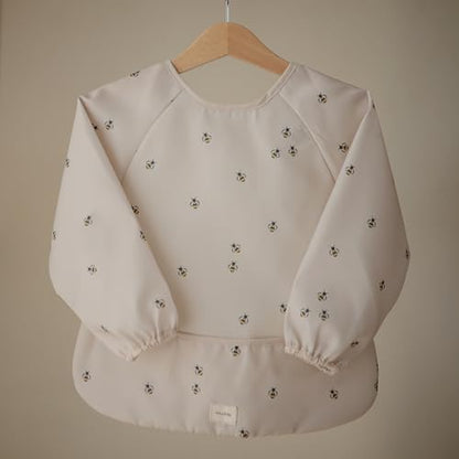 mushie Long Sleeve Baby Bib | Water Resistant Adjustable Fit - color: Bees
