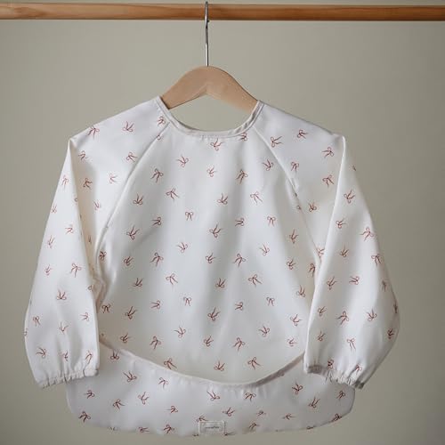 mushie Long Sleeve Baby Bib | Water Resistant Adjustable Fit - color: Bows