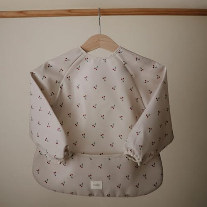 mushie Long Sleeve Baby Bib | Water Resistant Adjustable Fit - color: Cherries