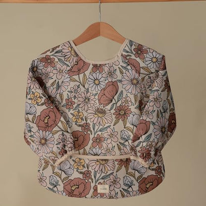 mushie Long Sleeve Baby Bib | Water Resistant Adjustable Fit - color: Retro Flowers